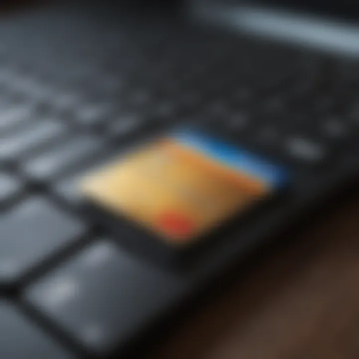 A close-up of a credit card on a laptop keyboard.