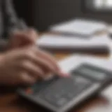 A person analyzing financial documents with a calculator