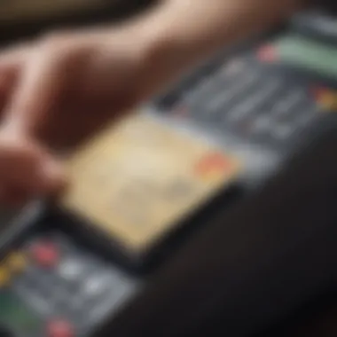 A close-up of a credit card being used at a point-of-sale terminal decorated with university logos.