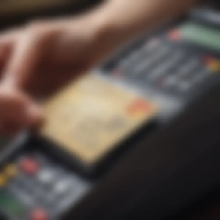 A close-up of a credit card being used at a point-of-sale terminal decorated with university logos.